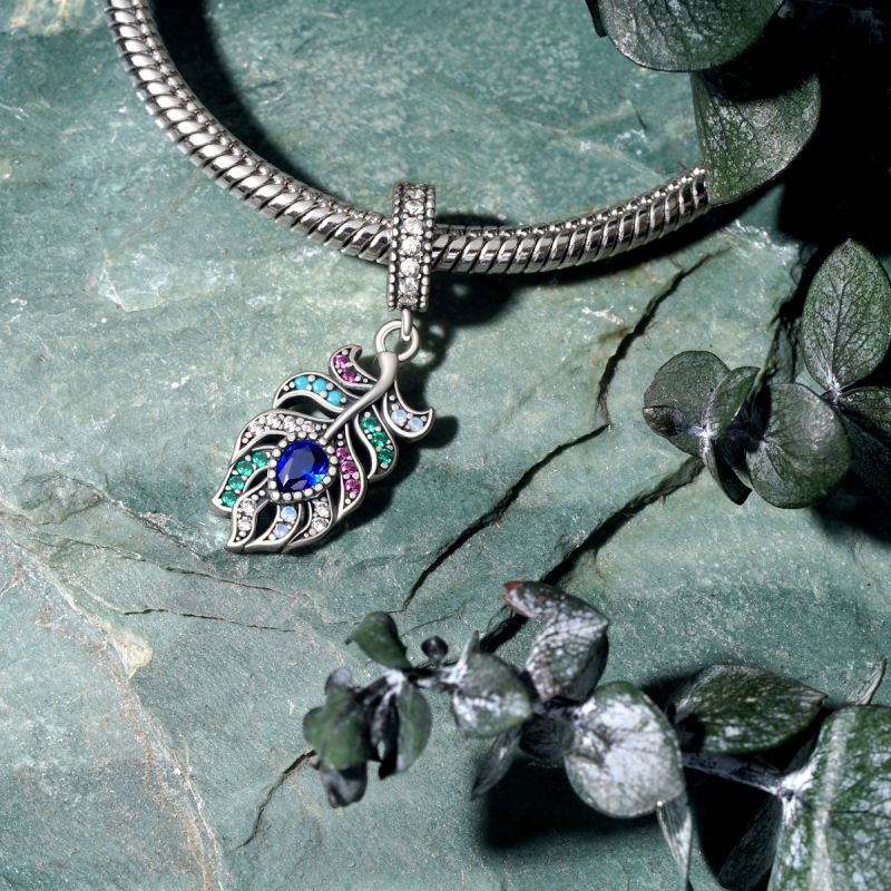 Peacock feather locket deals